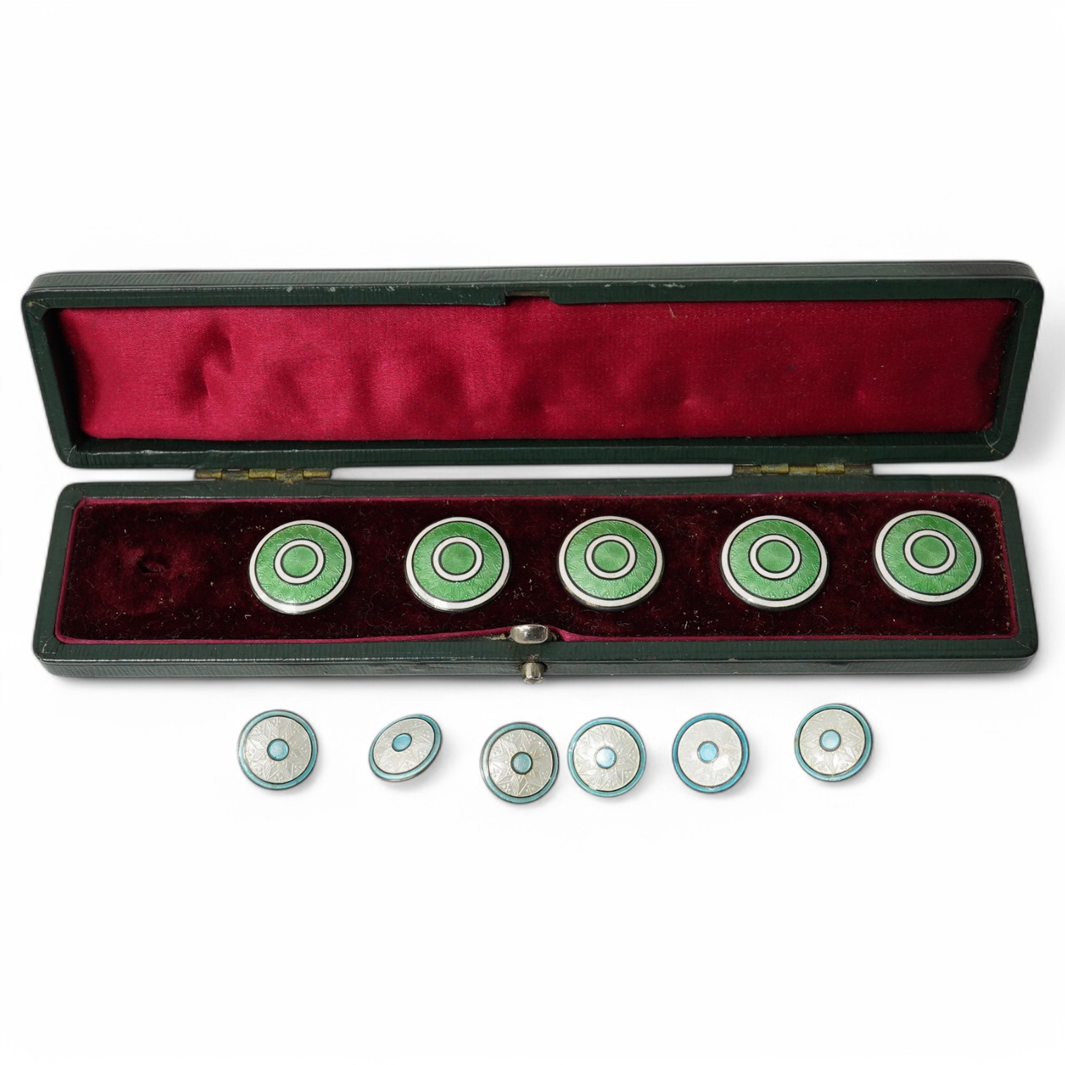 An Edwardian set of 6 blue and white enamelled buttons, marked Sterling, 10mm and a cased set of 5 (ex 6) green and white enamelled buttons, unmarked, 20mm. Condition - good